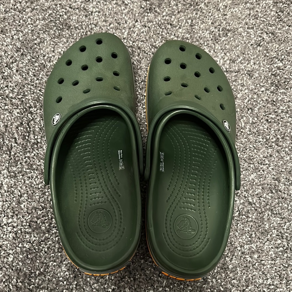 Men’s size 10 women’s 12 green crocs.